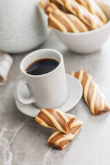 Classic Striped Cookies and coffee cup on kitchen table.