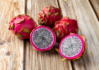 Pitayas or Dragon fruits over wooden table