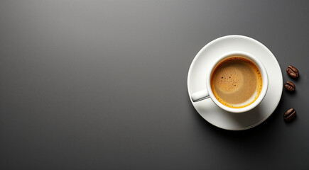Espresso in white cup on dark surface with scattered coffee beans. Contrast of creamy coffee against matte background provides modern aesthetic