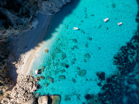 A drone view of Cala Goloritze, an azure beach located in the town of Baunei, in the southern part of the Gulf of Orosei, in the Ogliastra region of Sardinia.