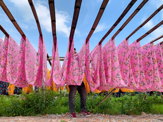 Drying colored cloth after dyeing. fabric making in Klaten.