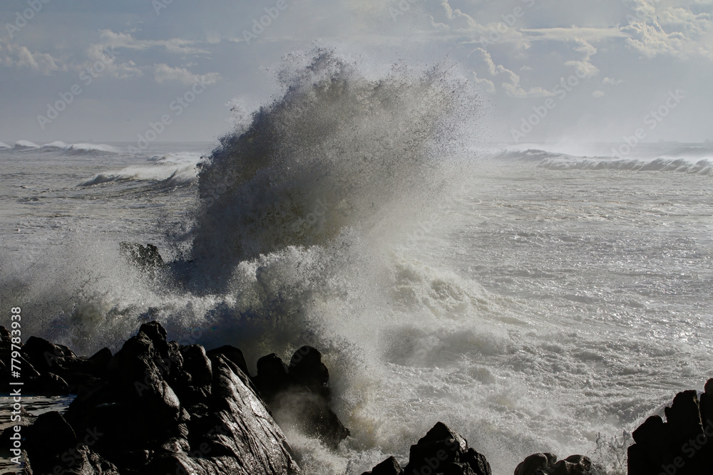 Canvas Prints small cape being hit by strong stormy sea waves