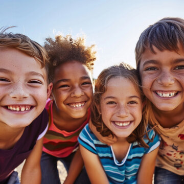 A group of children are smiling and posing for a picture