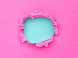 Ripped pink paper with hole in the center - 779788775