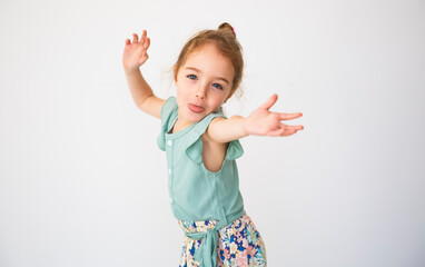Cute girl 4 year old posing in studio doing some grim - 779791744