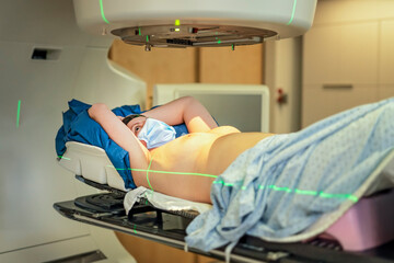Cancer treatment in a modern medical private clinic or hospital with a linear accelerator. woman lay is undergoing radiation therapy for cancer - 779792116