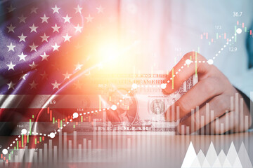 Businessman holding use banknote with USA flag and stock market graph chart for currency exchange and global trade forex concept.