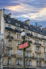 Paris, beautiful buildings boulevard Voltaire in the 11e arrondissement, with a subway sign
