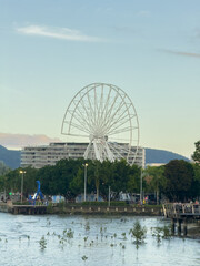 A large white Ferris wheel is in the background of a cairns city after cyclone