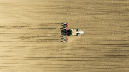 Aerial view of tractor sowing in agriculture area - 779805568