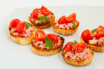 Delicious bruschetta (Italian Toasted Garlic Bread ) with ham and cherry tomato - 779805587