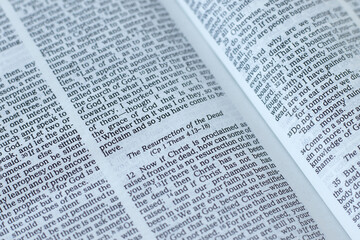 Christian resurrection verses in open holy bible book. Biblical concept of eternal life, hope and faith in God Jesus Christ.