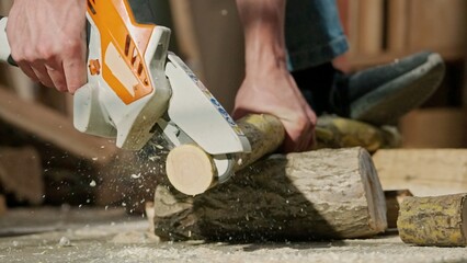 Male woodworker working in garage. Man professional carpenter working with wooden materials in...