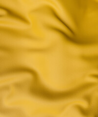 Looking down onto a piece of wrinkled yellow leather close up 3d render