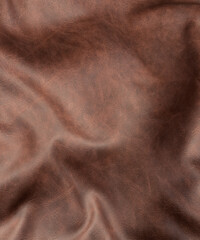 Looking down onto a piece of wrinkled brown leather close up 3d render