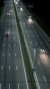 Aerial hyperlapse of traffic on freeway highway. Rush hour traffic on the road at night. hyperlapse, Vertical Screen Video