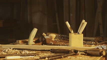 Cinematic shot of table with tools in the garage. Professional carpenter tools, equipment and...