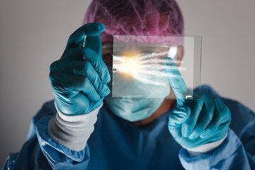 Doctor attentively examines the MRI scan of the patient. healthy concept.