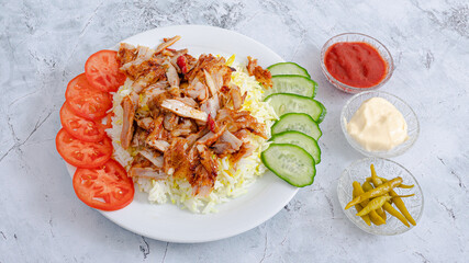 Chicken portion rice doner kebab plate top view	