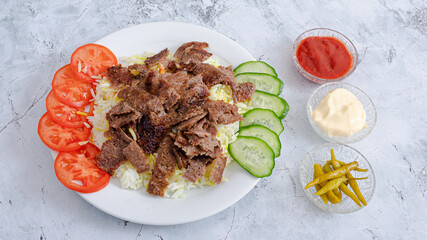 Beef portion rice doner kebab plate top view	