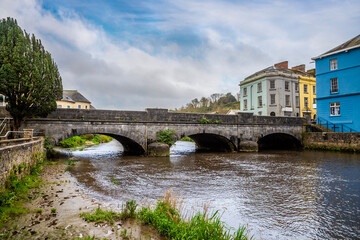 A view up the River Cleddau towards a road bridge in the centre of Haverfordwest, Pembrokeshire, Wales on a spring day