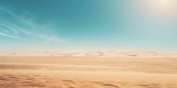A desert landscape with a clear blue sky. The sky is filled with clouds, but they are scattered and not too dense. The sun is shining brightly, creating a warm and inviting atmosphere