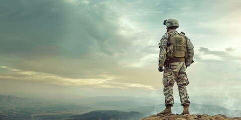 A soldier stands on a hill overlooking a city. The sky is cloudy and the soldier is wearing a backpack