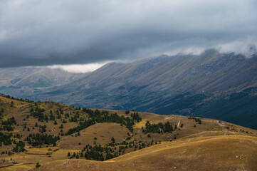 landscape inside Campo Imperatore during an autumnal cloudy day, Parco nazionale Gran Sasso, L'Aquila, Italy