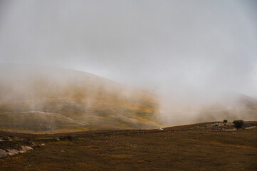 landscape inside Campo Imperatore during an autumnal cloudy day, Parco nazionale Gran Sasso, L'Aquila, Italy