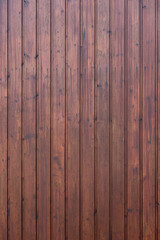 Background. wall made of wooden slats painted brownish red