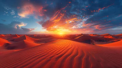 Poster A vast desert landscape with towering sand dunes under a fiery sunset sky © forall