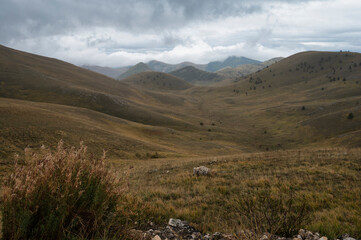 Fototapeta premium landscape inside Campo Imperatore during an autumnal cloudy day, Parco nazionale Gran Sasso, L'Aquila, Italy