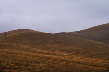 landscape inside Campo Imperatore during an autumnal cloudy day, Parco nazionale Gran Sasso, L'Aquila, Italy