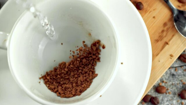 Super slow motion pellets of instant coffee fall . Filmed on a high-speed camera at 1000 fps. High quality FullHD footage