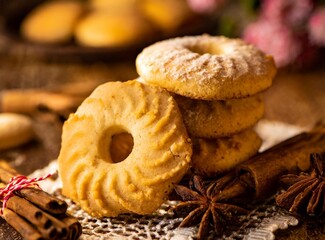 Tasty sweet sugar cookies on brown table, top view. Homemade hot pastry.