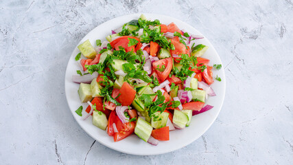 Cucumber tomato salad bowl isolated top view