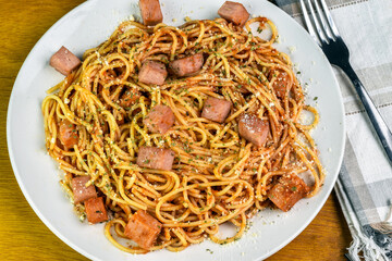  spaghetti  top with spam , parmesan cheese and parsley