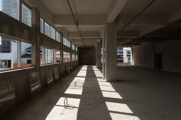 A cement structure inside an unfinished building