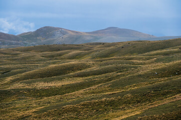 landscape inside Campo imperatore during an autumnal cloudy day, Parco nazionale del Gran Sasso, L'Aquila, Italy