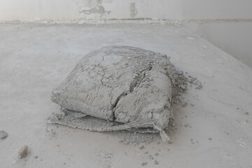 A bag of cement that hardened when exposed to water