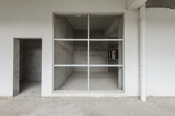A cement structure inside an unfinished building
