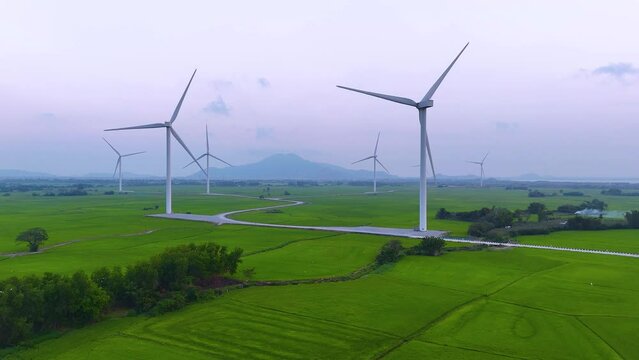 view of turbine green energy electricity, windmill for electric power production, Wind turbines generating electricity on rice field at Phan Rang, Ninh Thuan province, Vietnam