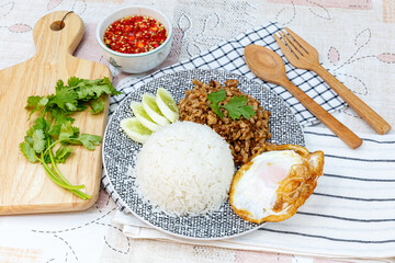 Traditional Thai street food, Fried Pork With Garlic On Rice with Egg