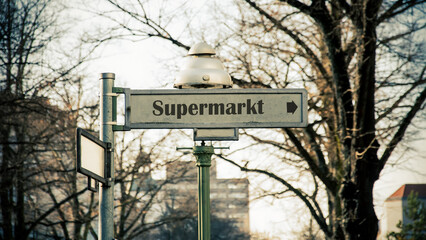 Signposts the direct way to Supermarket - 779854749