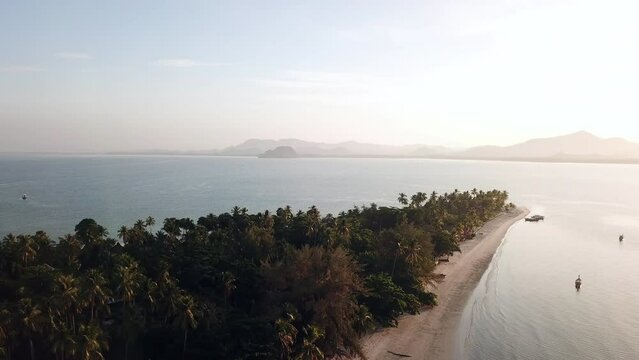 Aerial view of koh Mook or Muk island with beautiful sky and sunrise, in Trang, Thailand. It is a small idyllic island in the Andaman Sea in the south of Thailand.