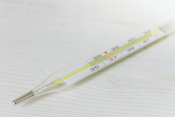 Mercury thermometer with celsius degrees, isolated. Medical thermometer on white background. Normal human temperature. Health diagnostic. Illness test. Medical equipment.  - obrazy, fototapety, plakaty