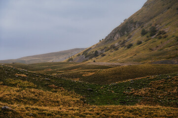 Fototapeta premium landscape inside Campo imperatore during an autumnal cloudy day, Parco nazionale del Gran Sasso, L'Aquila, Italy