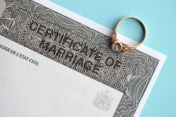Canadian Certificate of registration of marriage blank document and wedding ring close up