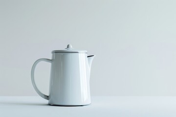 Modern minimalist design electric kettle on a soft grey background