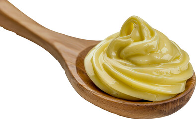 Creamy mayonnaise swirl on wooden spoon cut out on transparent background